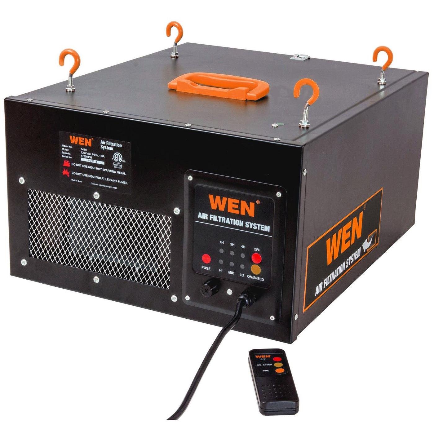 WEN 3410 workshop air filtration system with black metal housing, orange mounting hooks and remote control